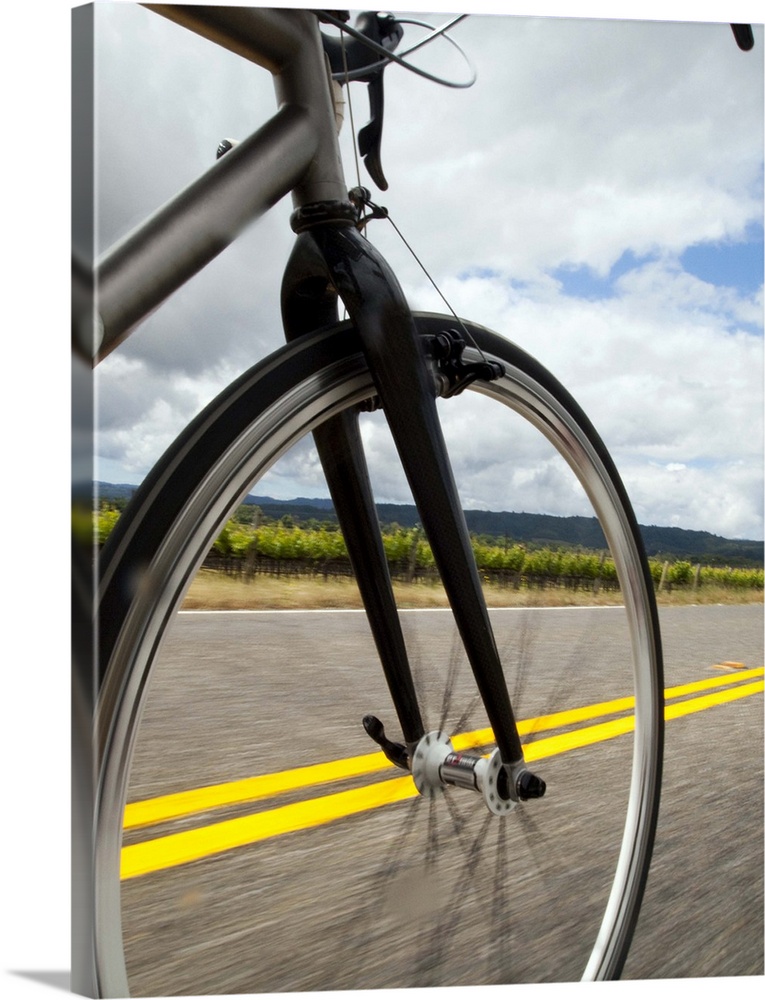 Man road biking at high speed POV