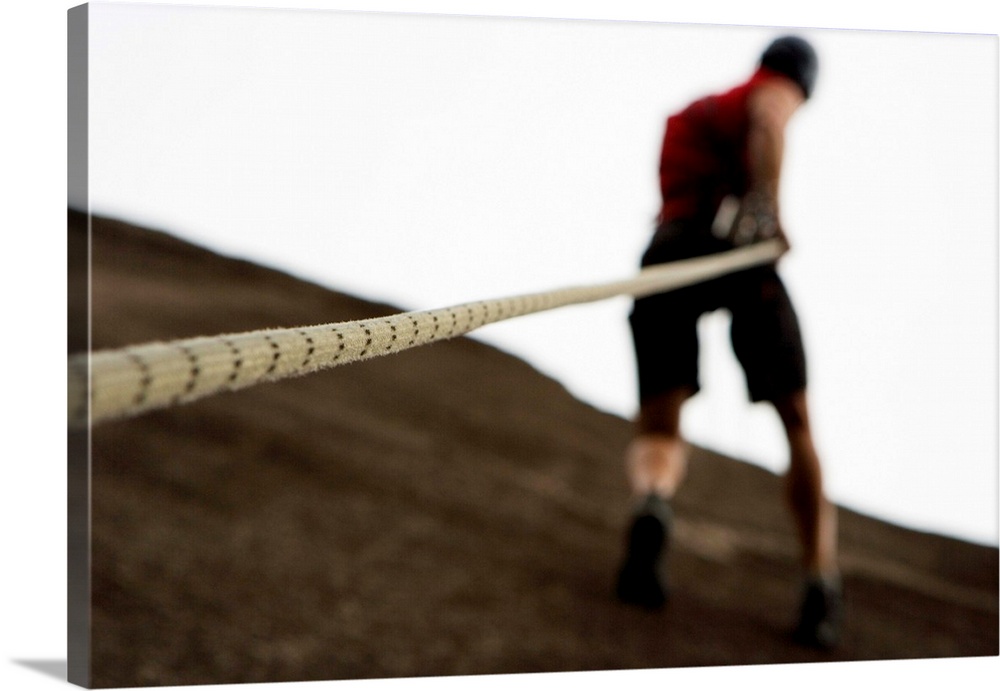 Man rock climbing with rope