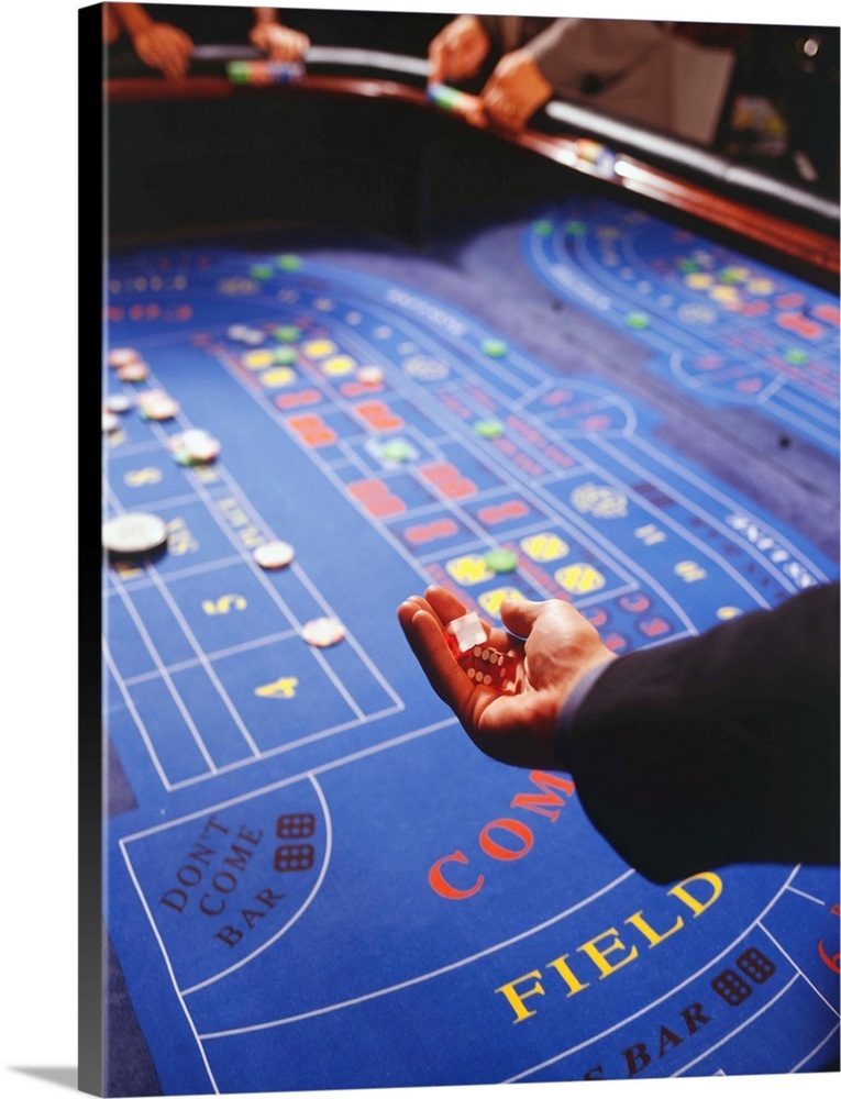 Man shaking dice during game of craps in casino Wall Art, Canvas Prints