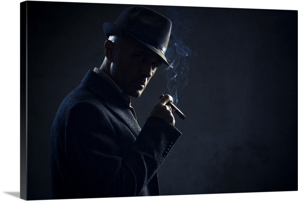 Man with cigar in dark background.