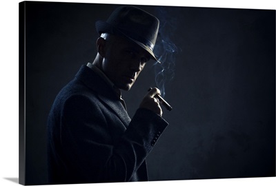 Man with cigar in dark background