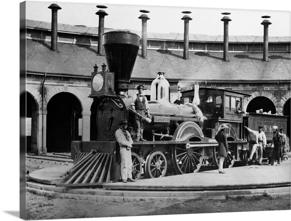 Men turn the Great Western Railway steam locomotive No. 4. in 1859. The locomotive is mainly British in design.