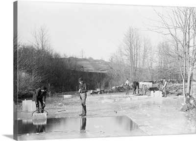 Men Cutting Ice From Frozen Pond