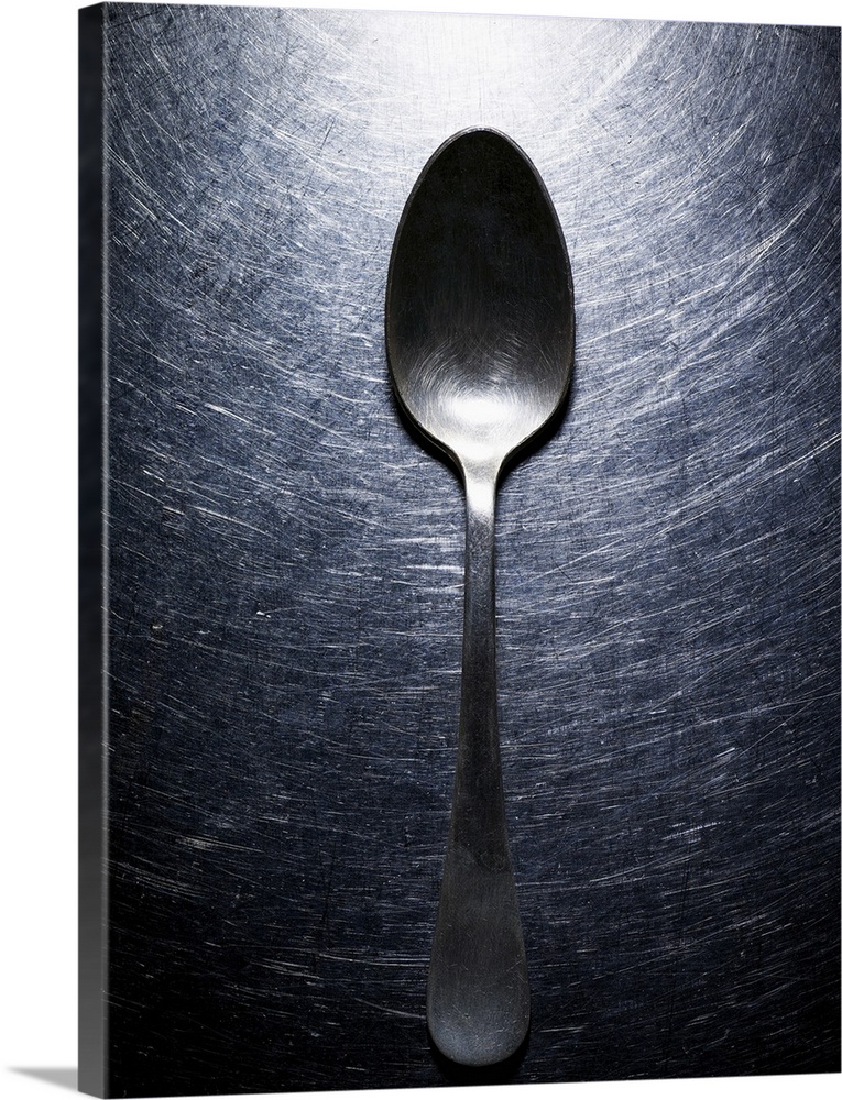 Metal spoon on stainless steel.