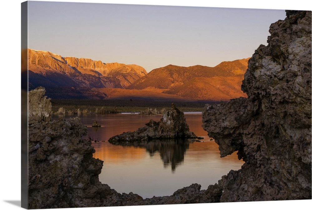 A tufa tower, formed of solidified calcium carbonate bubbling from the soil, stands amidst the waters of Mono Lake, a larg...