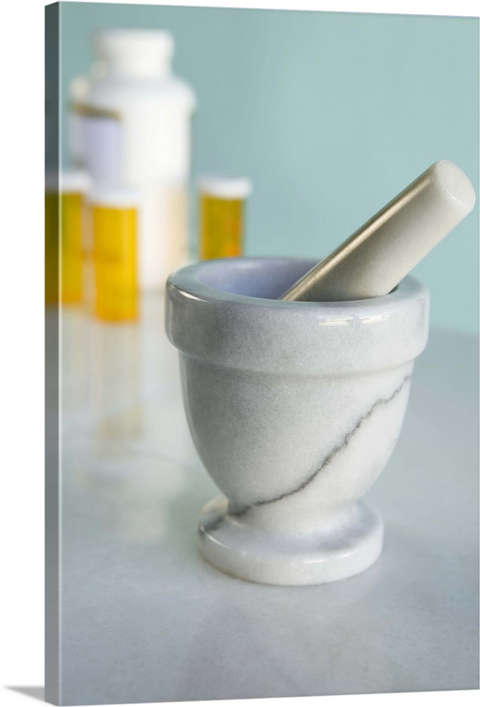 Mortar and pestle, pill bottles in background