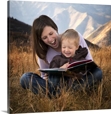 Mother and son reading outdoors