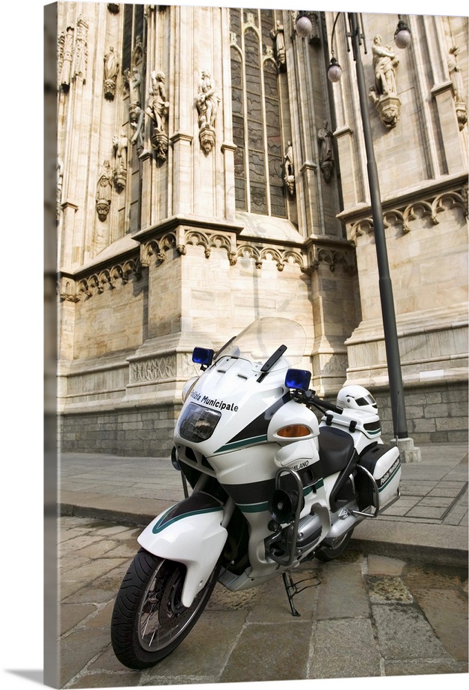 Motorcycle parked outside Duomo di Milano, Milan, Italy