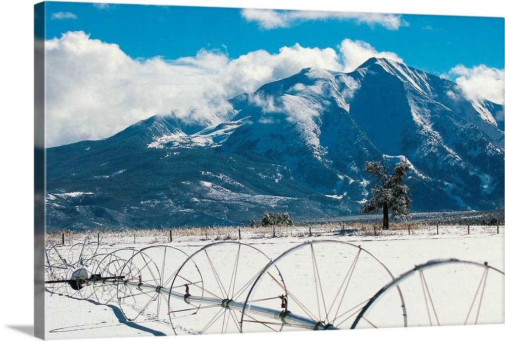 Fresh snow on its flanks, Mt. Sopris stands dominant against field of new powder at ranch on Thompson Creek Road outside C...