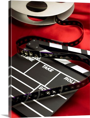 Movie clapboard and film reel