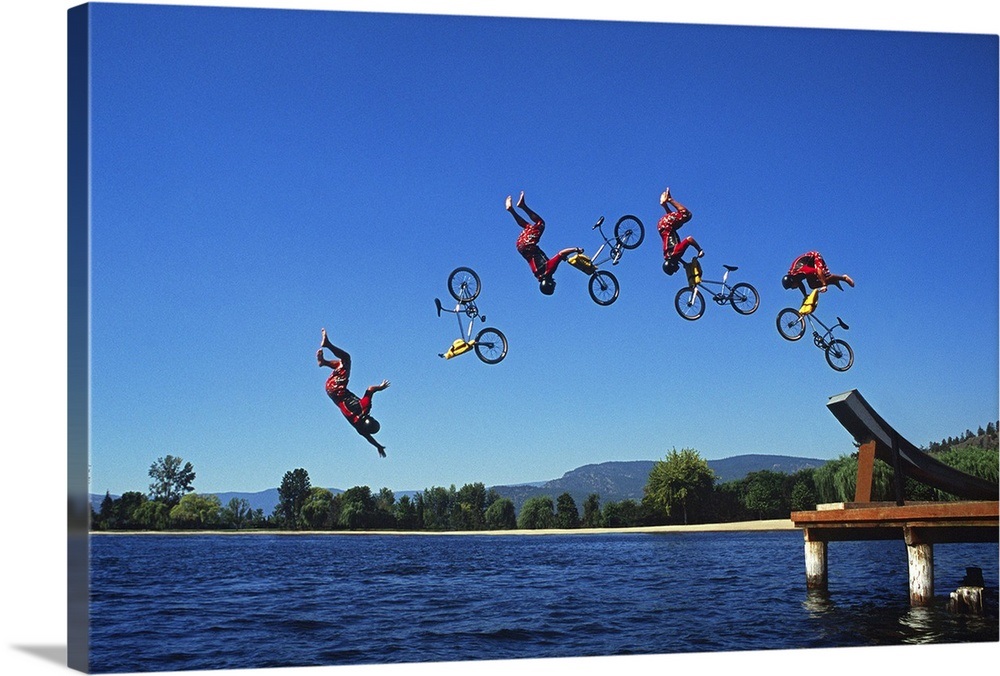 Multiple exposure of cyclist going off jump into water Wall Art, Canvas Prints, Framed Prints
