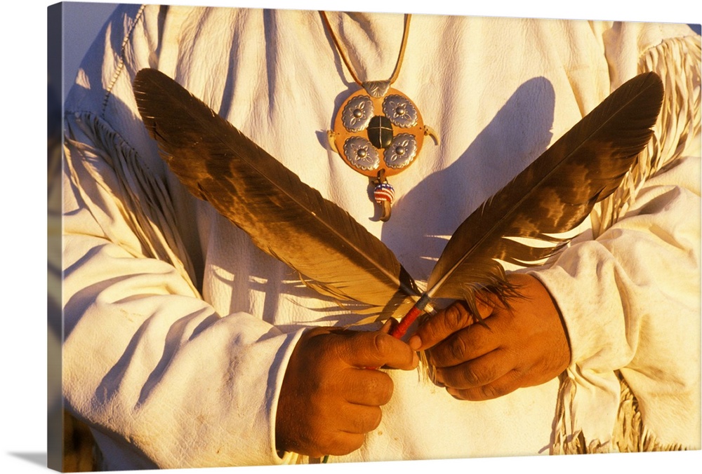 'Close-up of a Native American holding ceremonial feathers, Big Sur, CA'