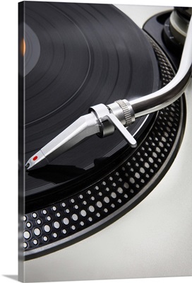 Needle on a turntable playing a record