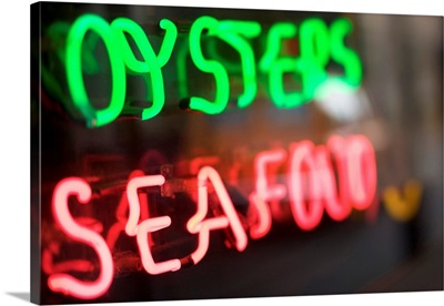 Neon oysters and seafood sign