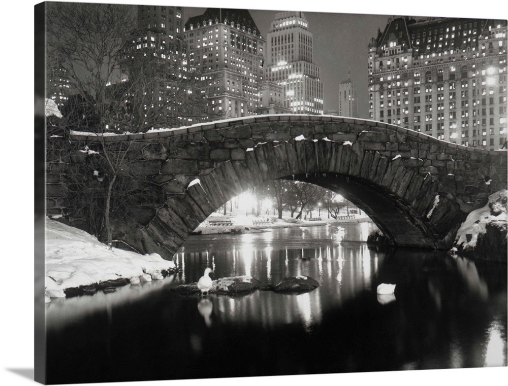 12/6/1957-New York, New York- Majestic apartment houses and hotels along New Yorks City's Fifth Avenue glow like christmas...