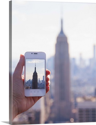New York State, New York City, Manhattan, Tourist taking photo of Empire State Building