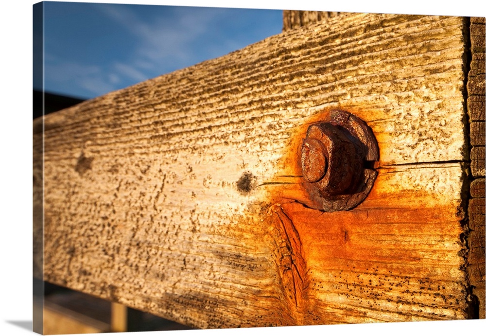 Nut and bolt on a weathered wood wall