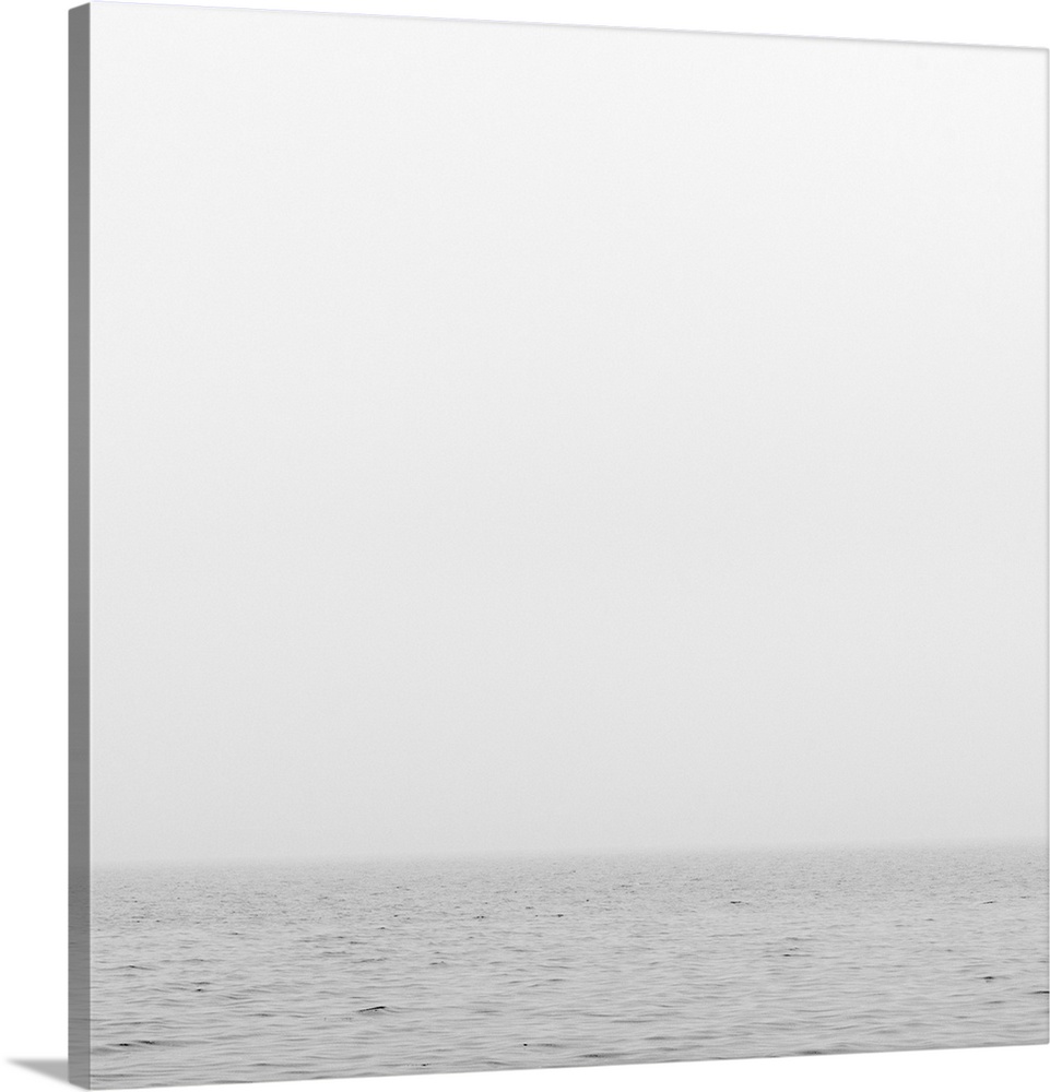 Sea or ocean onfoggy day. cloudy gray sky and gray water blend together at  horizon line.