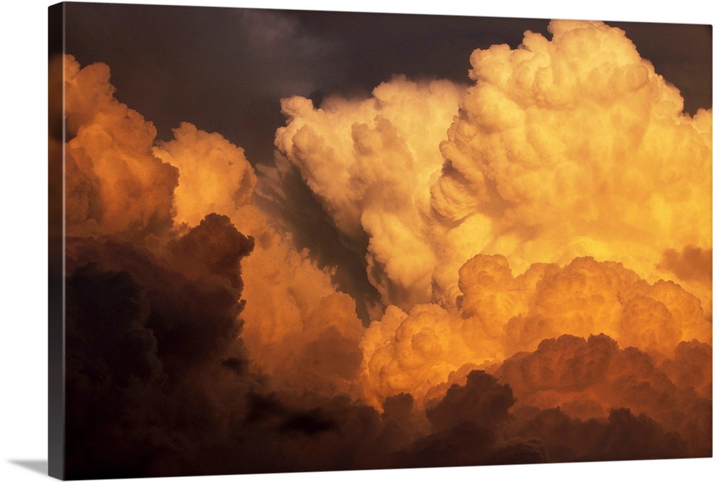 Sunlight hits a massive swell of cumulonimbus clouds looming over Texas. | Location: Above Sweetwater, Texas, USA.