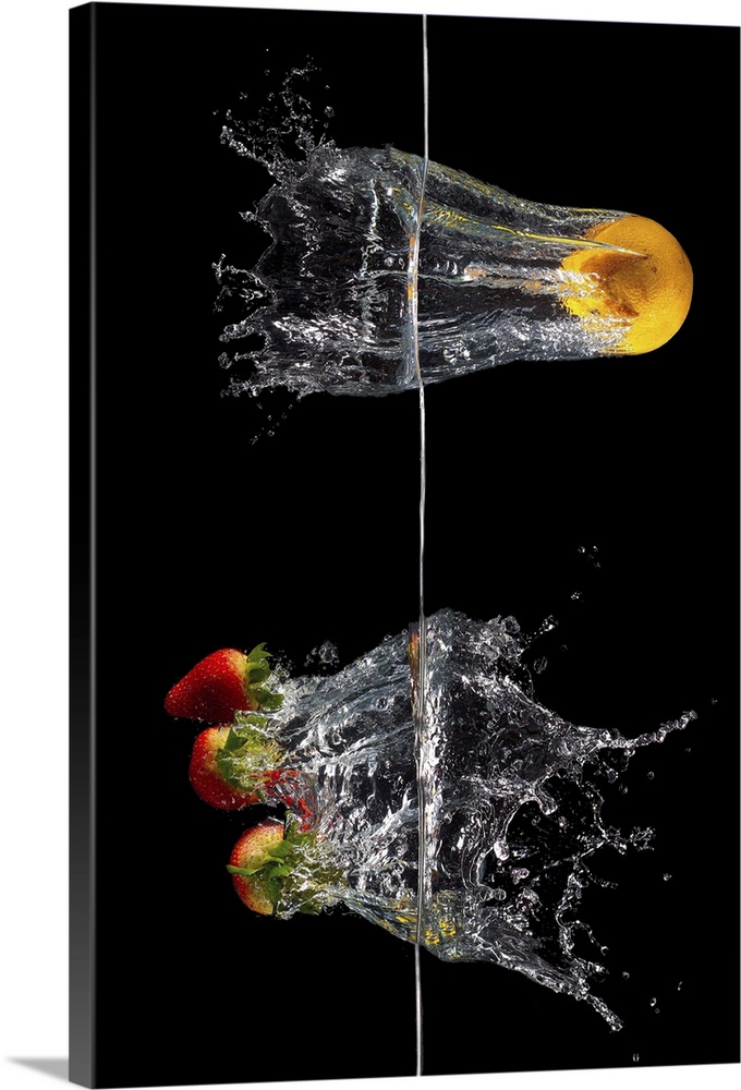 Flashy stock art using an orange and strawberry dropped from opposite sides of waterline.