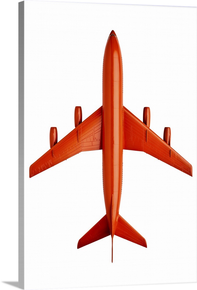 Orange plastic model of an airliner / plane, on white background, cut out