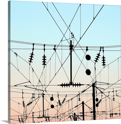 Overhead lines station, train electricity wires with evening sky.