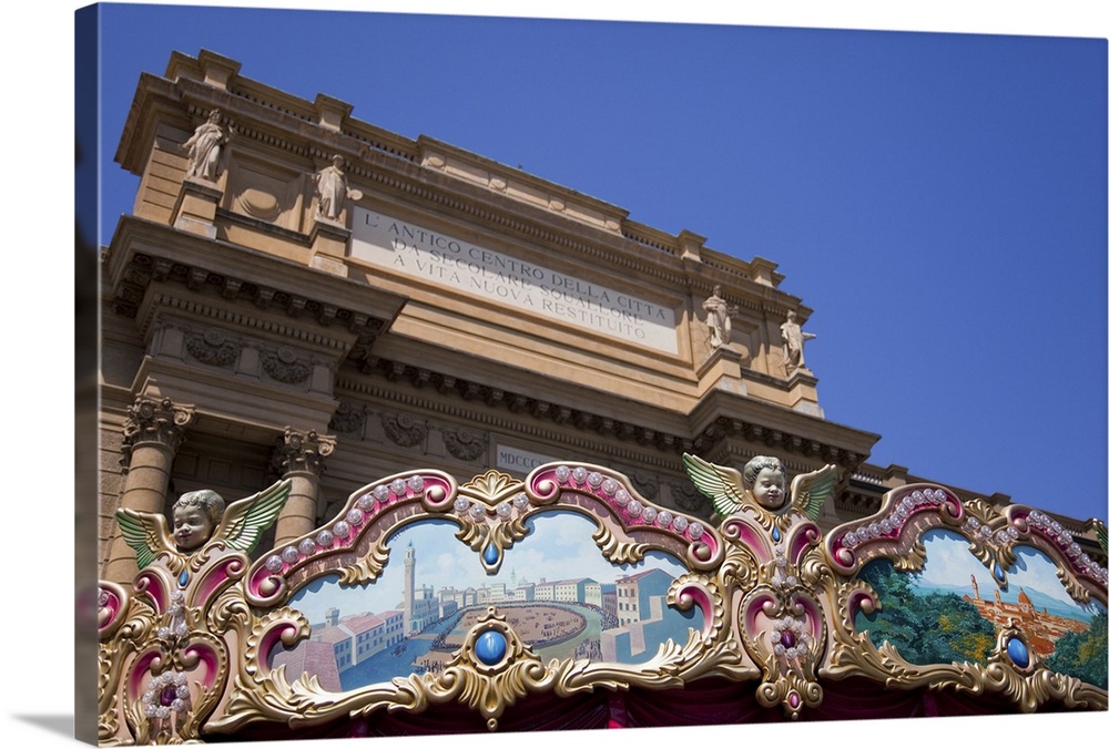 painted decorative carousel with pictures of Florence and Sienna in front of the triumphal arch in Piazza della Repubblica