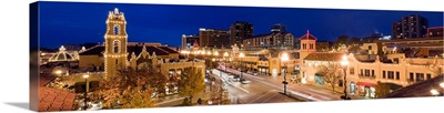 Panoramic view of the Country Club Plaza at dusk from above, lit up for the holidays.
