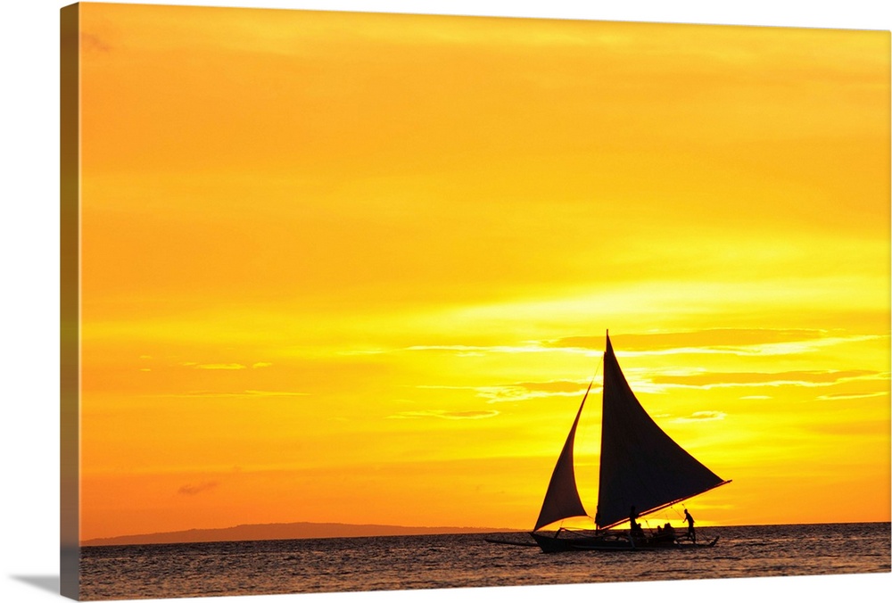 Paraw sailing at sunset, Philippines.