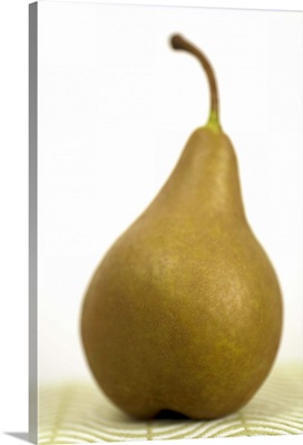 Pear sitting on a mat