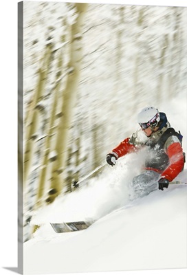 Person downhill skiing