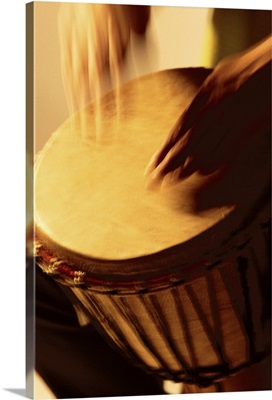 Person playing the bongo drum