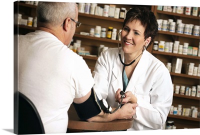 Pharmacist taking patient s blood pressure