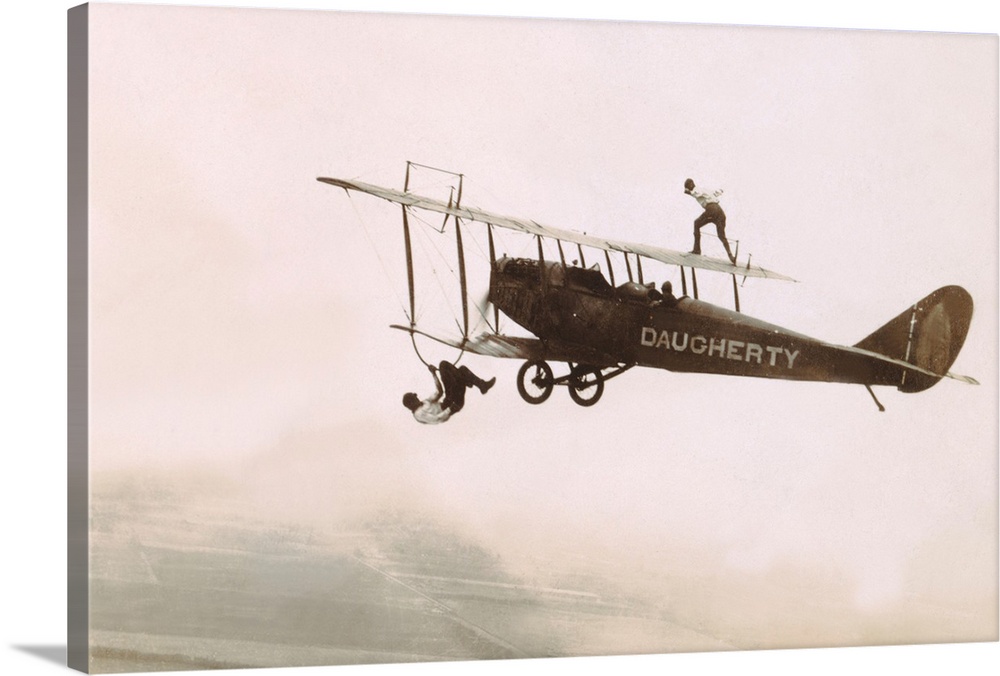 1910-1930 - Photograph of a Wingwalkers on a Biplane - Image by K.J. Historical/CORBIS