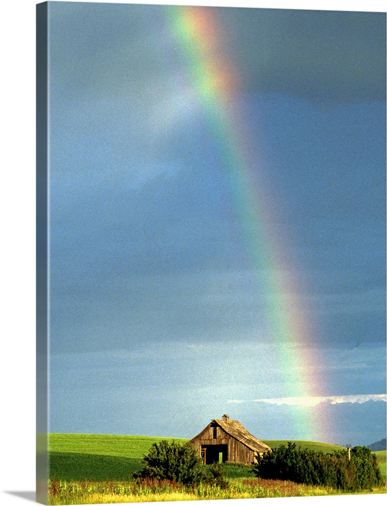 Picturesque rainbow and rustic barn