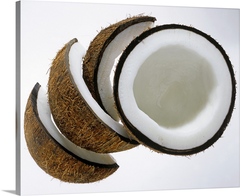 Pieces of coconut against white background, Close-Up