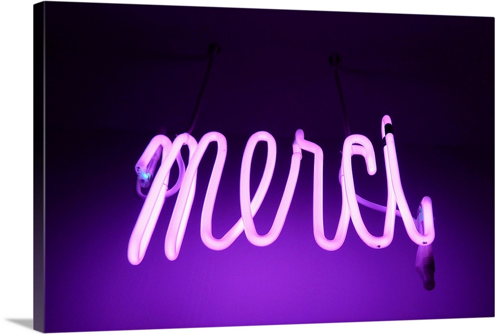 Pink and purple Neon light sign saying merci (thanks in french).
