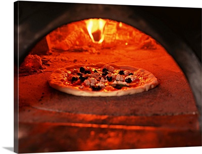 Pizza baking in the forno