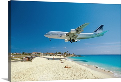 Plane coming in for landing on Maho Bay Beach, Saint Martin, Caribbean