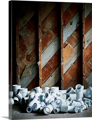 Plastic pipes on floor of construction site