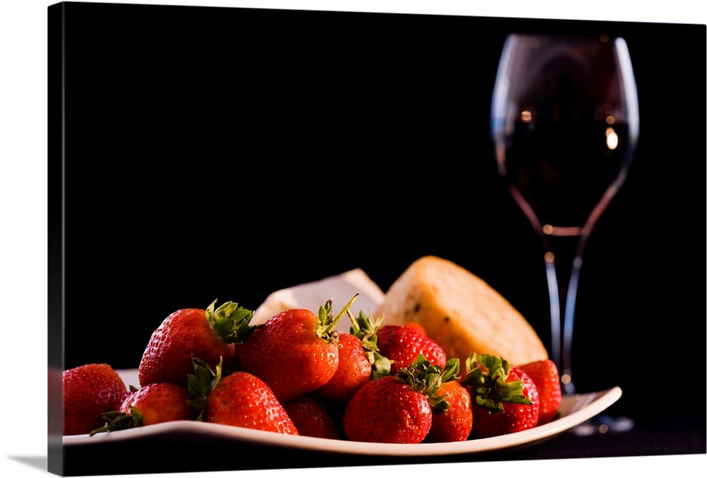 This is a horizontal photograph of fruit, cheeses, and wine against a dark backdrop making this a wonderful decorative acc...