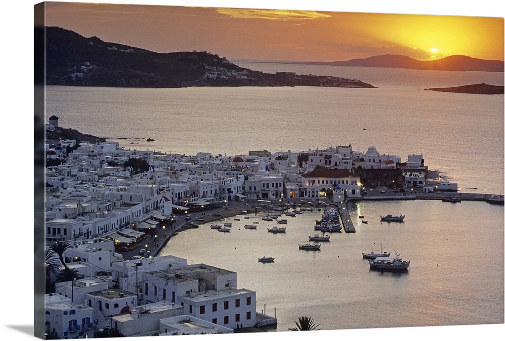 Port of the island of Mykonos, one of the Cyclades islands in the Aegean sea at sunset.