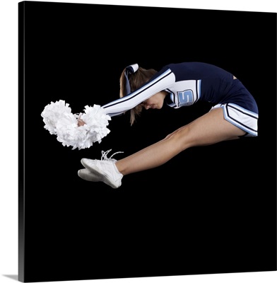 Portrait of teenage cheerleader girl  jumping