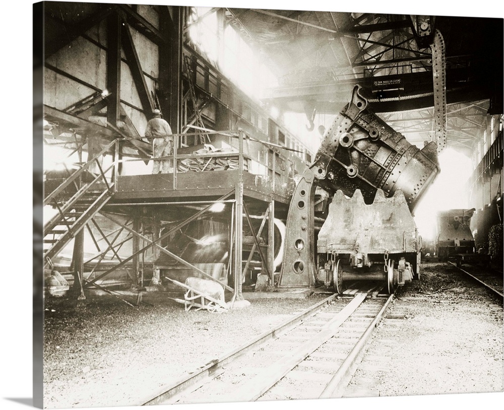 A pouring ladle, a huge bucket of molten steel, is emptied at the huge River Rouge Plant of the Ford Motor Company.
