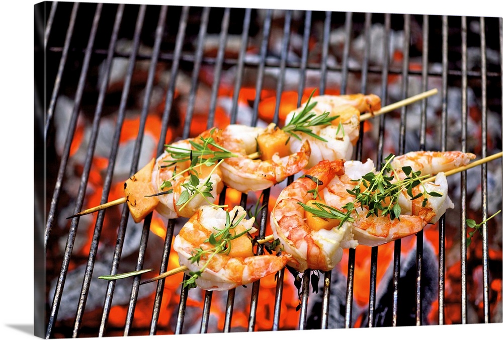 Prawn skewers on barbecue, close-up