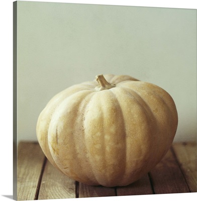 Pumpkin on wooden table.