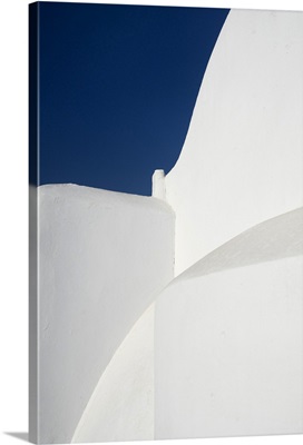 Pure white church against blue sky on greek island of Paros