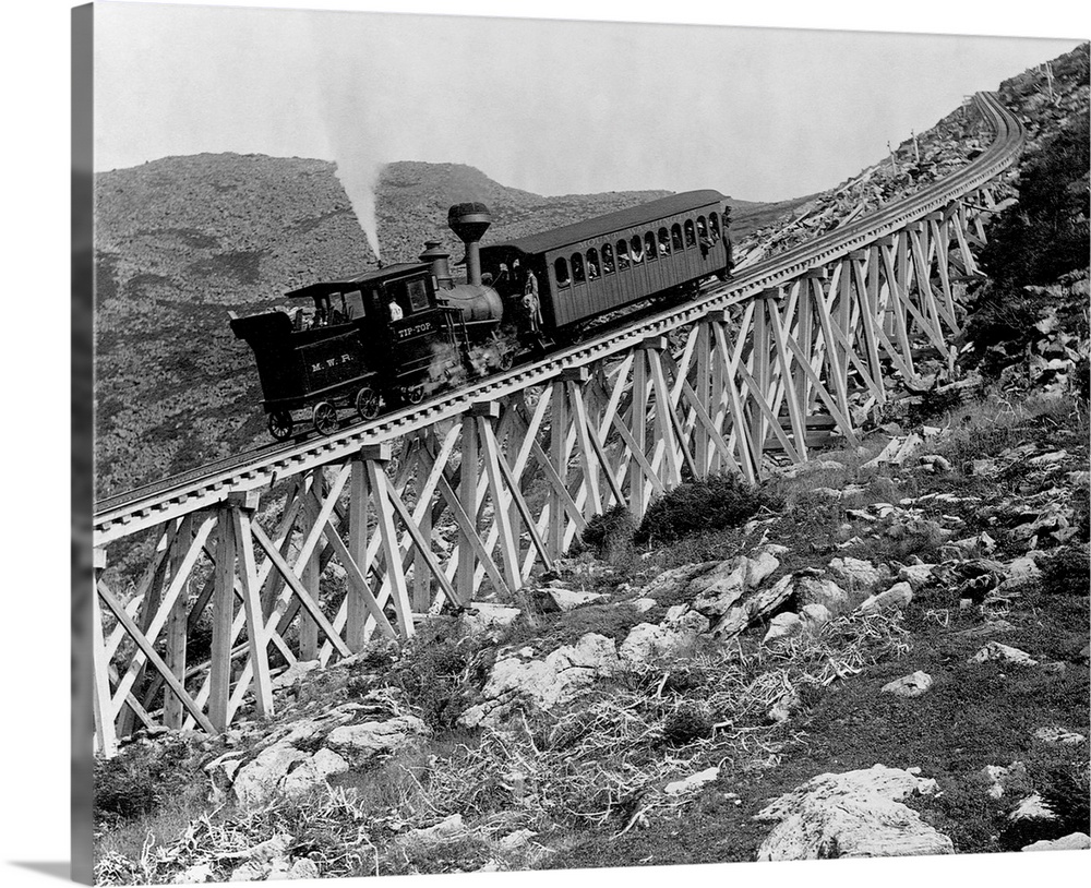 A locomotive pushes a passenger car up Jacob's Ladder, a steep railroad bridge on Mount Washington in New Hampshire. 1895.