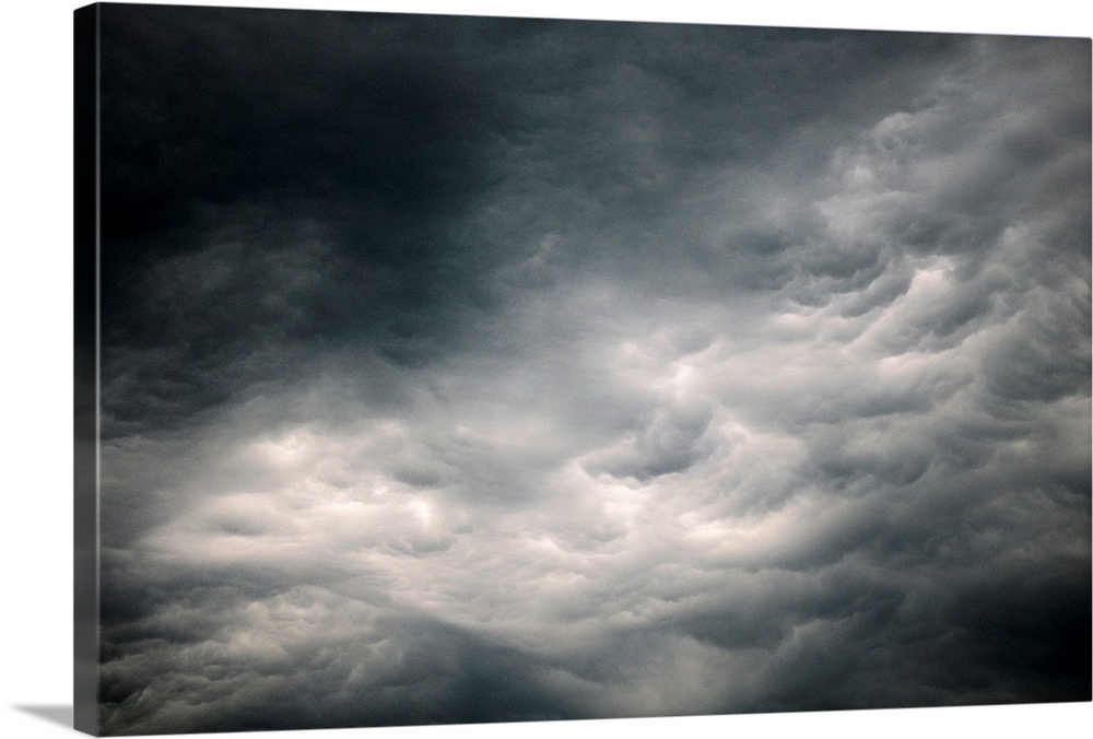Photograph of dark, ominous rain clouds in the sky.