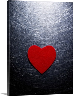 Red Felt Heart on Stainless Steel Background.